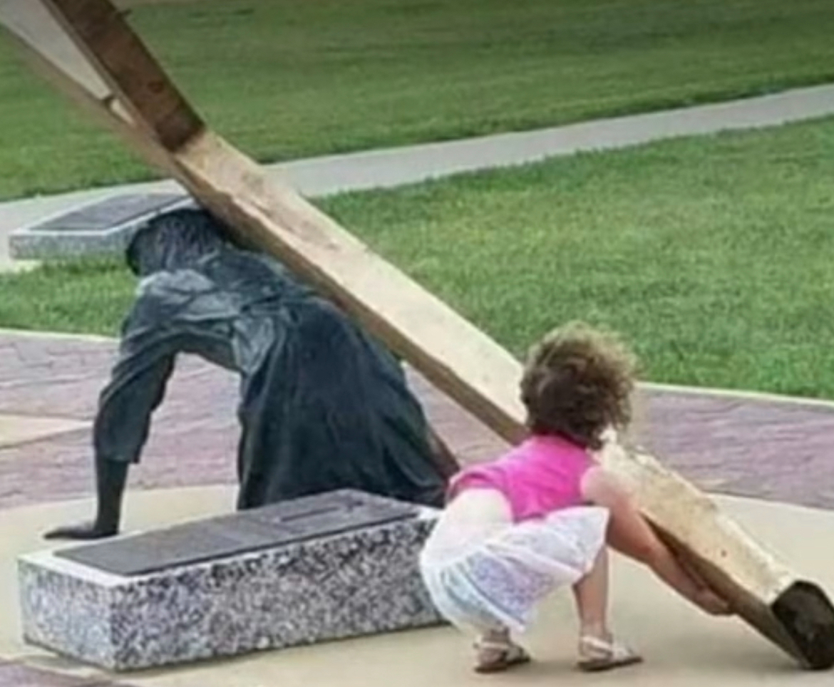 This is a statue of Jesus falling as he was carrying the cross to Calvary to die for your sin. We see a little girl in this scene trying to help him carry it. She seems to instinctively know what she must do. How about you?
