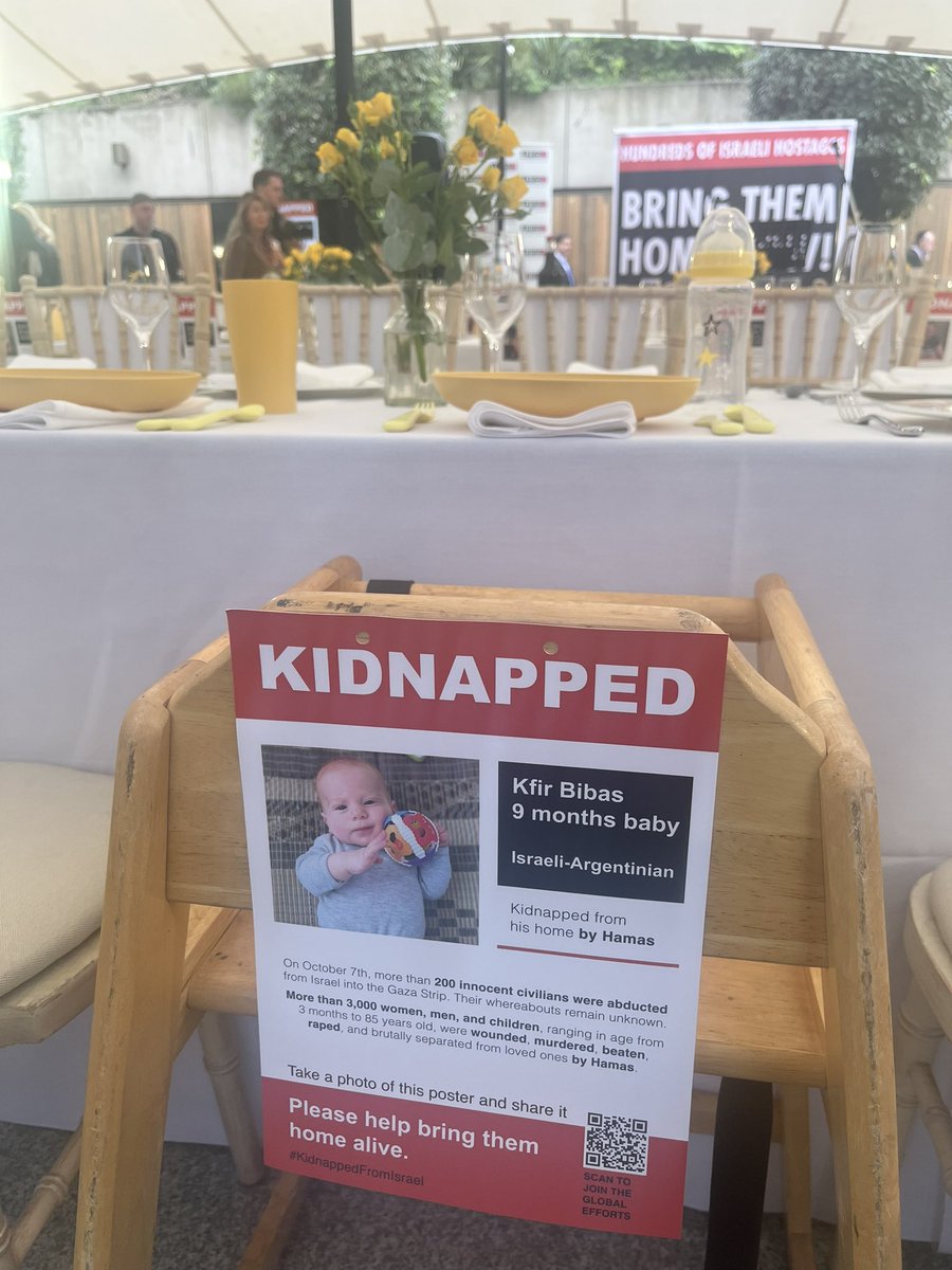 I don’t think I’ve ever been at an event like this where all around me people are sobbing. 
Jewish community centre <a href="/jw3/">j w</a> has recreated a #BringThemHome Shabbat table for all the missing hostages including high chairs for the babies.