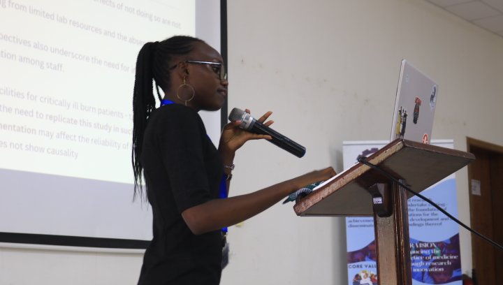 Sylvia Nyakeo a Kenyatta University Med student presenting her research  abstract about burns Thrombophylaxis.
