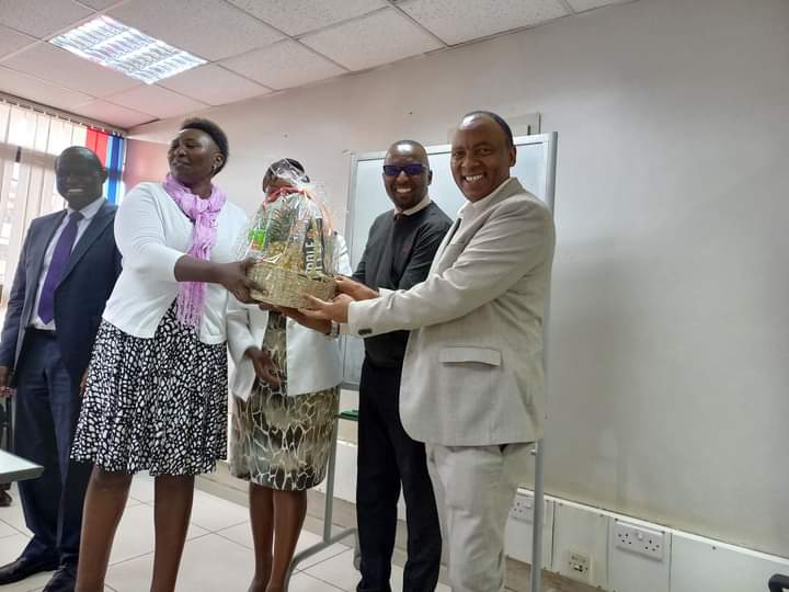 Britam Managing Director Tom gitogo far right receiving a gift humper,it was a privilege ,.the MD ellaborated on the dedication to steering the company to making it a great financial provider that indeed safe guards dreams and aspirations
