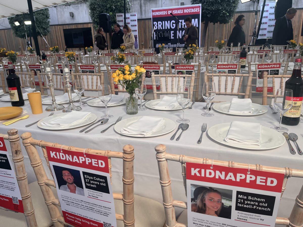guy_lynn's tweet photo. Giant empty Shabbat table in London - with 224 seats for the 224 men, women and children kidnapped by Hamas who won't be celebrating the Jewish sabbath tonight #gaza #israel #Jewish #BringThemHome https://t.co/aax72v5t9W