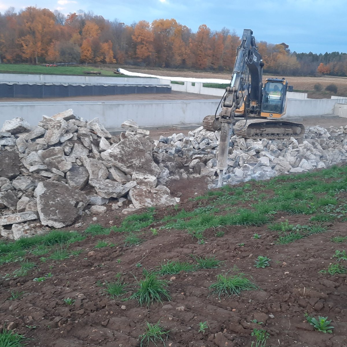 Resizing the okd concrete for crushing and reusing on-site. No trucks involved reducing our carbon footprint.