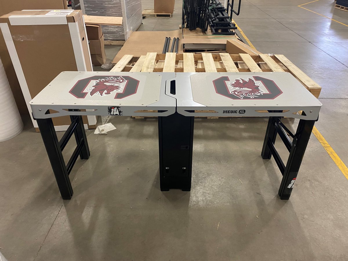 Impact_athletic's tweet photo. Thank you @GamecocksOnline for the order! This Medic XL table is built to last and hold up to weather and all the elements! @SCATCs @SEATA9 @NATA_ICSM @GamecockFB https://t.co/Offfbb2SQ0