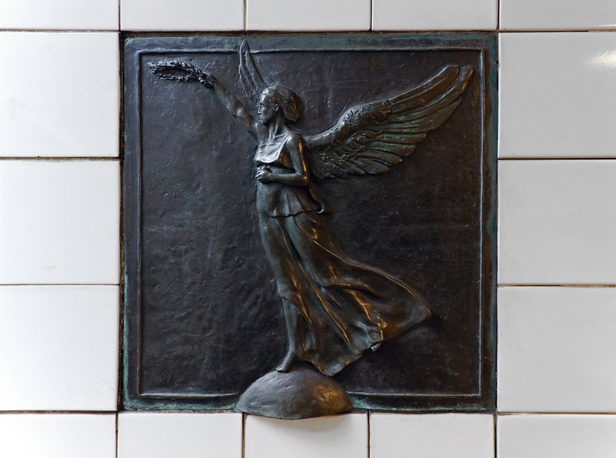 MTAArtsDesign's tweet photo. Happy 119th birthday to the subway! New York City’s transit history is celebrated in Jane Greengold’s “Wings for the IRT: The Irresistible Romance of Travel” (1995) at Grand Army Plaza (2,3) station, which depicts Winged Victories leading a subway car. https://t.co/M0SPN9cCrz https://t.co/aTPSnJT2Ek