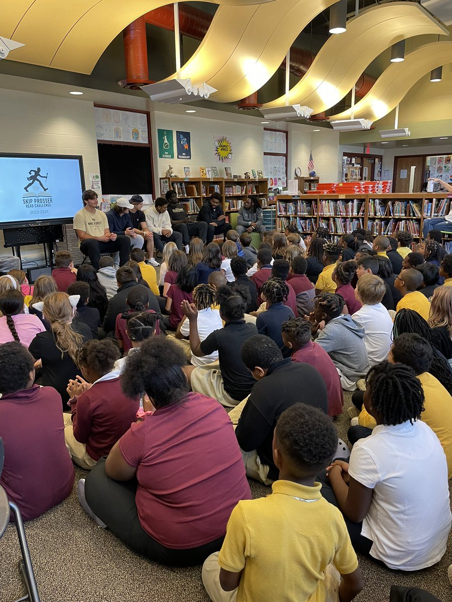 SpeasBeesRead's tweet photo. #SpeasG4 students are stepping up to the #READchallenge. @Wakeforest football players stopped by today to encourage all of our @SpeasGlobal 4th graders to read! #GoDeacs. #SpeasBeesRead https://t.co/UjslqBRWBz