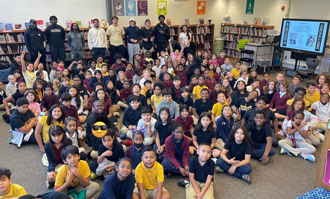 SpeasBeesRead's tweet photo. #SpeasG4 students are stepping up to the #READchallenge. @Wakeforest football players stopped by today to encourage all of our @SpeasGlobal 4th graders to read! #GoDeacs. #SpeasBeesRead https://t.co/UjslqBRWBz