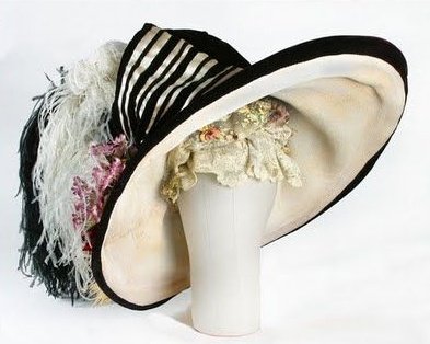 FlowerLawe's tweet photo. The New York premiere of My Fair Lady was held in 1964. The large Cecil Beaton cotton burlap picture hat, trimmed in black velvet with ostrich feathers and faux flowers, was worn by Audrey Hepburn in the iconic Ascot scene. https://t.co/8kbmyZjMHF
