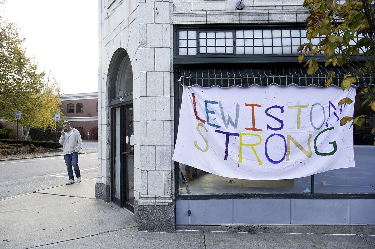 A crew under Jeremy Hiltz, left, of Recovery Connections of Maine made 'Lewiston Strong' banners that hang in varoius locations in downtown Lewiston. Hiltz is friends with a number of people killed during Wednesday's mass shootings. (Daryn Slover/Sun Journal)