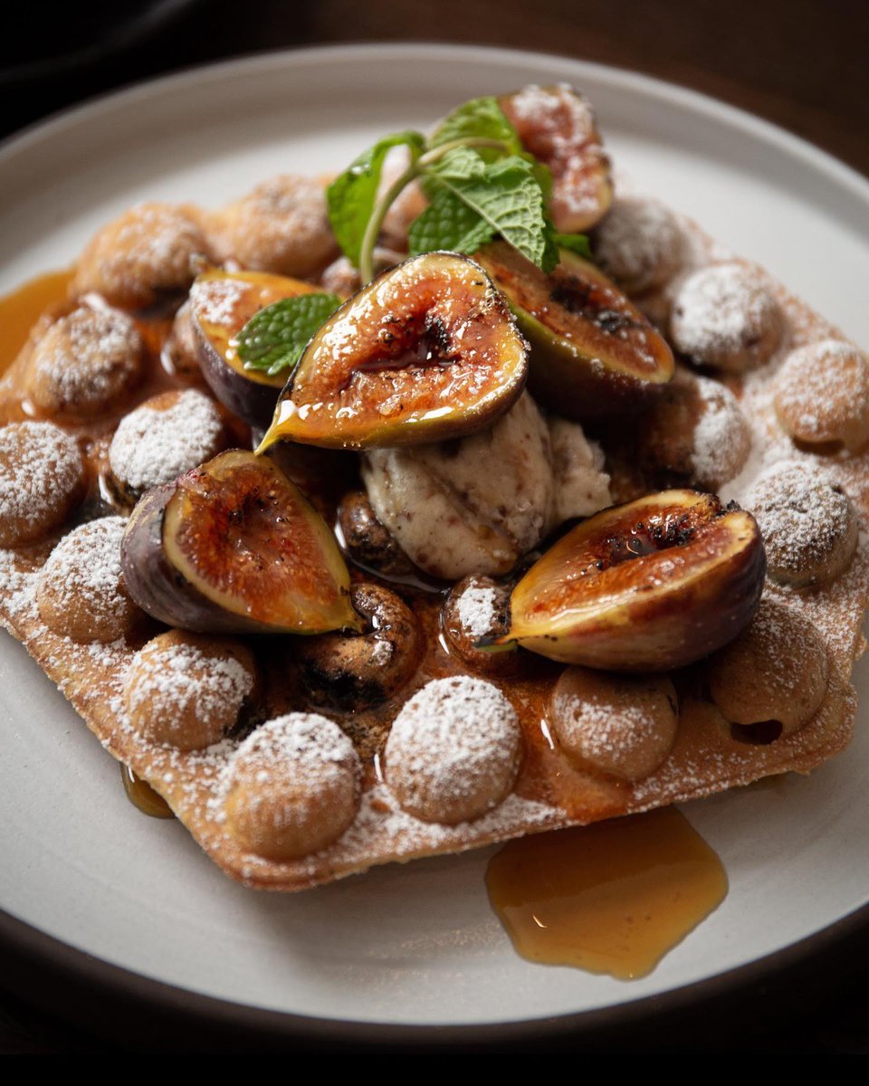 Caramelized figs, praline butter, and whiskey maple syrup top Chef’s Huckleberry Bubble Waffle — part of the new autumn breakfast menu at @GoldfinchTavern. bit.ly/3Sk6hsl