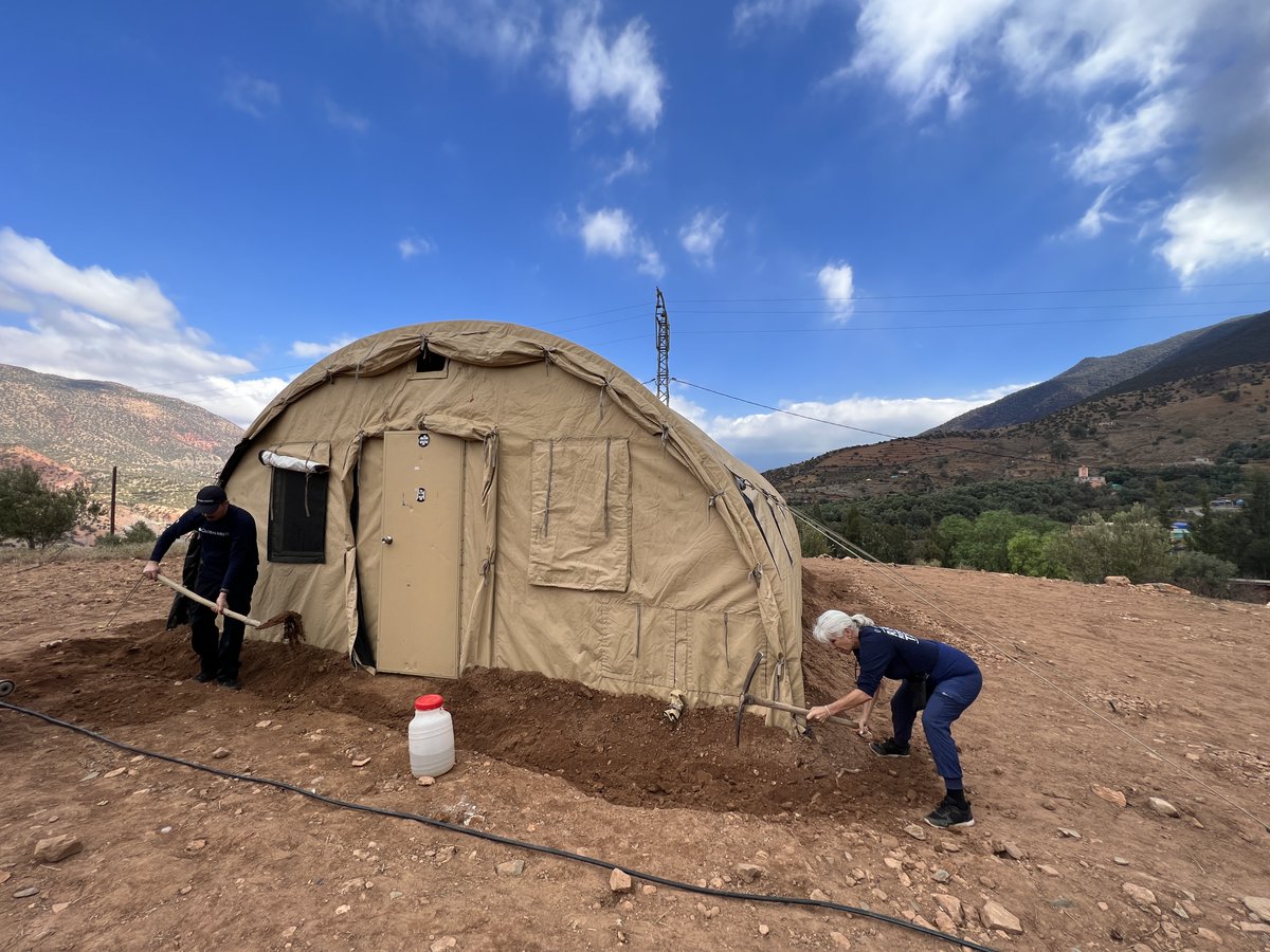 globalmedicdmgf's tweet photo. We set up a tent as a classroom for a school that was damaged by the earthquake but now, the rainy season has started in Morocco. In order to protect the tent, our Rapid Response Team deepened the trench surrounding it to divert any flooding from entering it. https://t.co/w4GmCkSonz