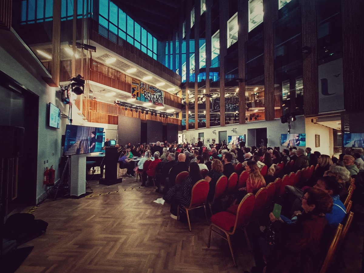 BelfastFestival's tweet photo. Stunning surroundings this evening as we're treated to gala concert Zoom Time - Over &amp; Out featuring @UlsterUni's Acoustronic, @QUBelfast's Performance Without Barriers, @NMcCarthyPiano and @UlsterOrchestra #BIAF23 https://t.co/OhaPIRU1SE