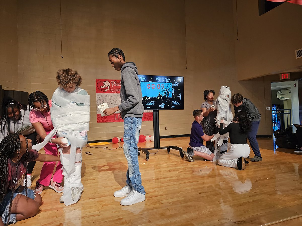 whit_farrell's tweet photo. And that's a WRAP on #CSMSRRW ❤️ Base Camps competed against each other in a Minute to Win It mummy wrapping contest 👻⚰️🧟‍♂️  #RedRibbonWeek2023 @CSMS_Huskies https://t.co/pH91n0QLb8