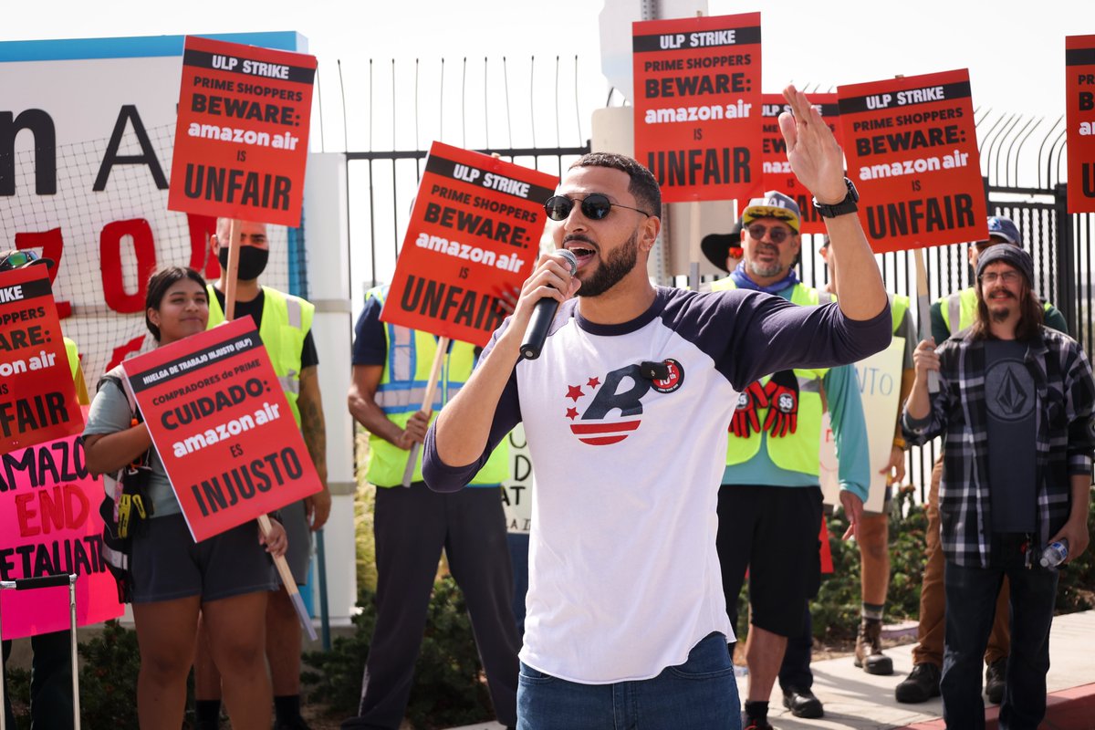 <a href="/IEAmazonWorkers/">KSBD Amazon Teamsters</a> + <a href="/SBACommunities/">San Bernardino Airport Communities</a> are leading the way to fight back in a region already suffering from Amazon’s polluting, dangerous, and poverty wage standards. (6/7)