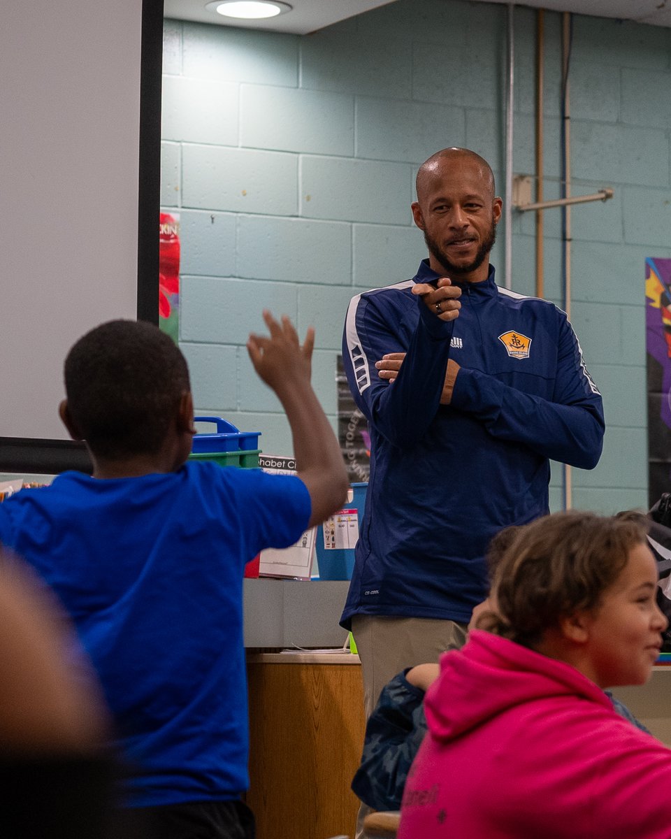 RhodeIslandFC's tweet photo. Coach Khano  visited @ProjectGoalRI yesterday in Central Falls! After a Q&amp;A in the  classroom he had a kickaround with the kids on their amazing futsal courts.

#AnchoredInCommunity | #RIFC | #ProjectGoal https://t.co/X1yTA7TI6C