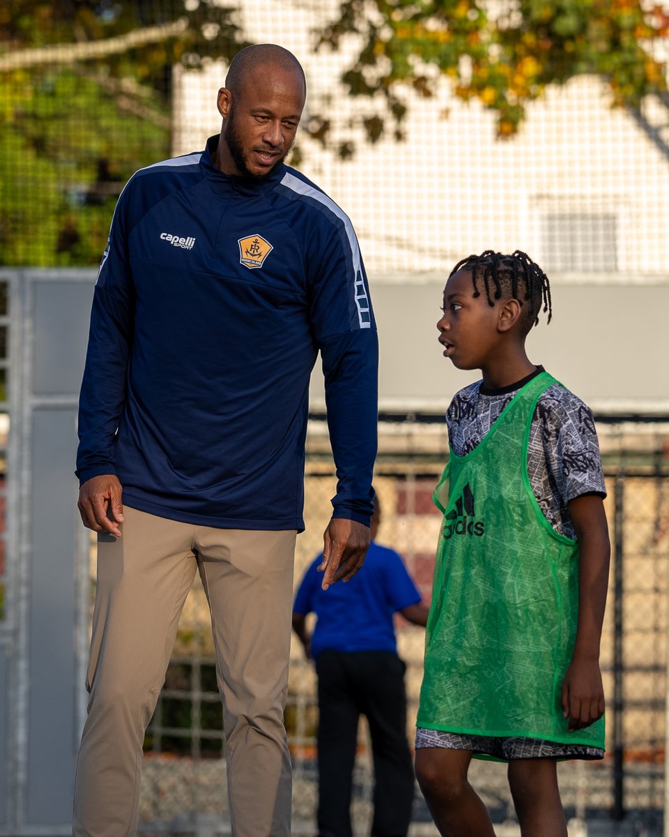 RhodeIslandFC's tweet photo. Coach Khano  visited @ProjectGoalRI yesterday in Central Falls! After a Q&amp;A in the  classroom he had a kickaround with the kids on their amazing futsal courts.

#AnchoredInCommunity | #RIFC | #ProjectGoal https://t.co/X1yTA7TI6C