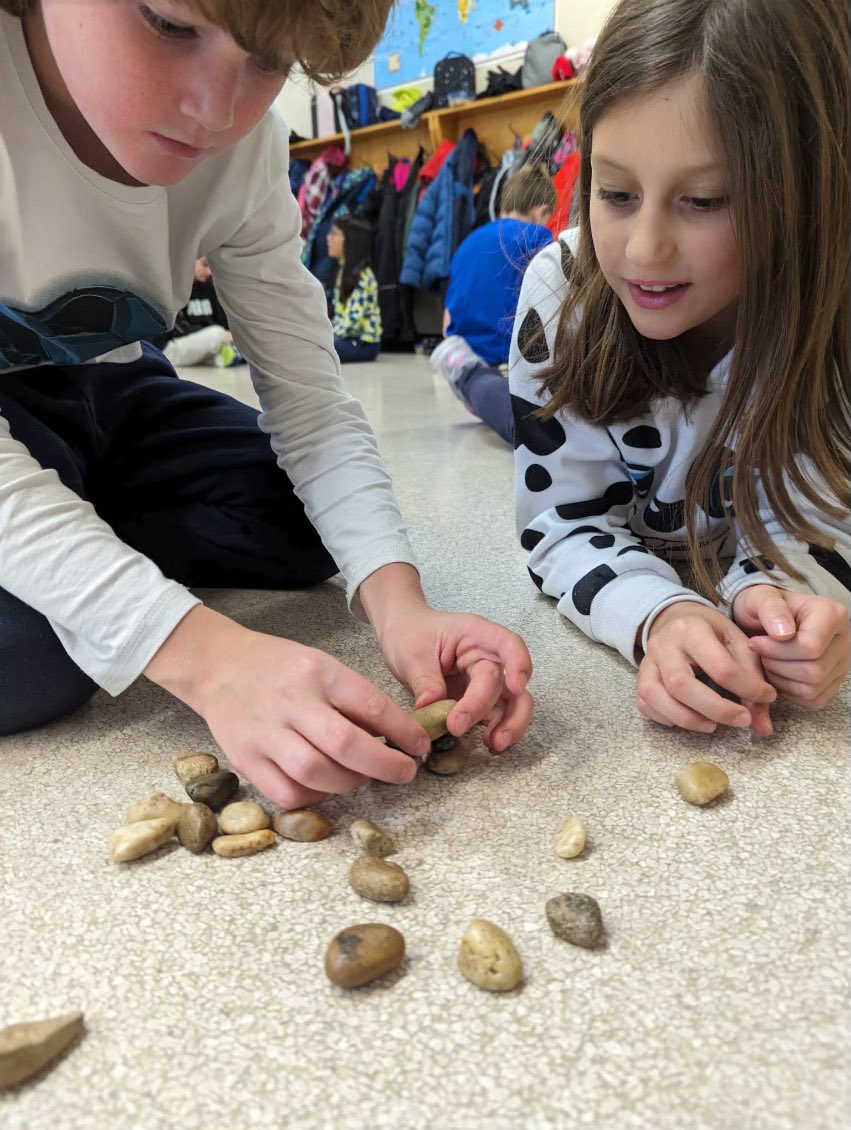 Grade 3 students learning about the relationship between indigenous communities and natural materials by building inukshuks. @CCSD_edu