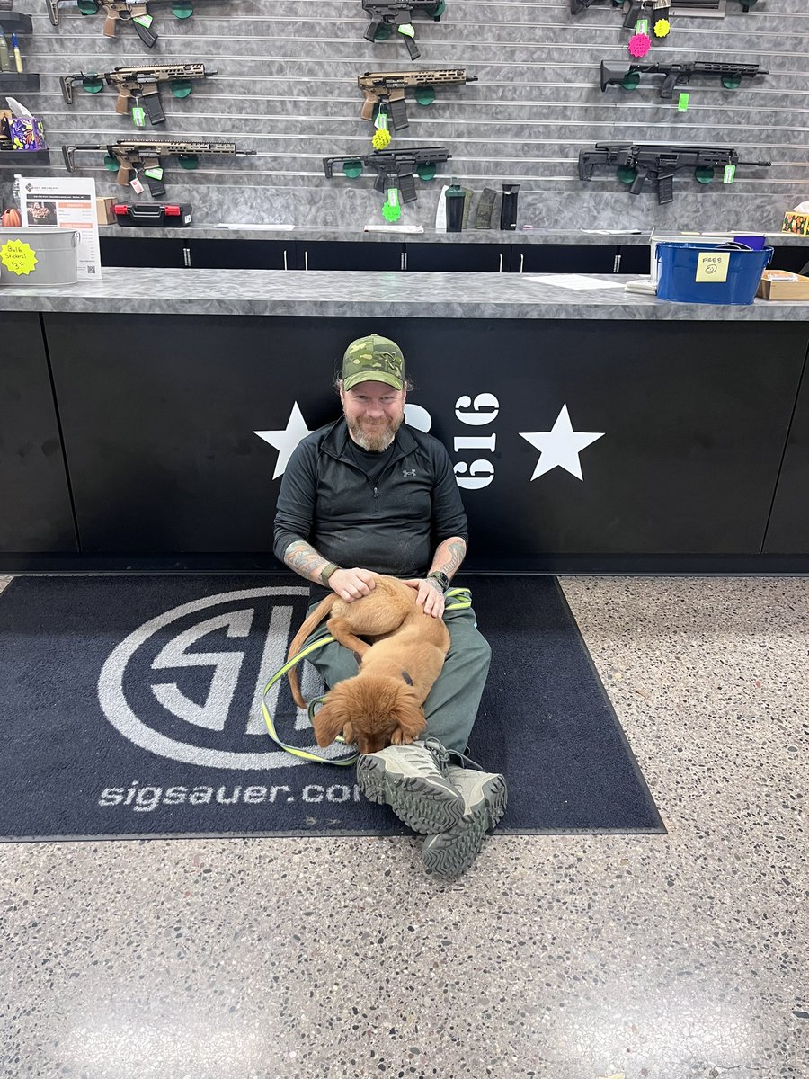 Barracks616's tweet photo. Come out and meet our latest addition, Jubilee! Guaranteed to put a smile on your face while firearm/accessory shopping. Sitting with Instructor/Puppy Whisperer, Zak, and they’ll both make sure you have a pleasant experience here at Barracks. 
#barracks616 #grandrapidsmi #gooddog https://t.co/nANb38rOB1