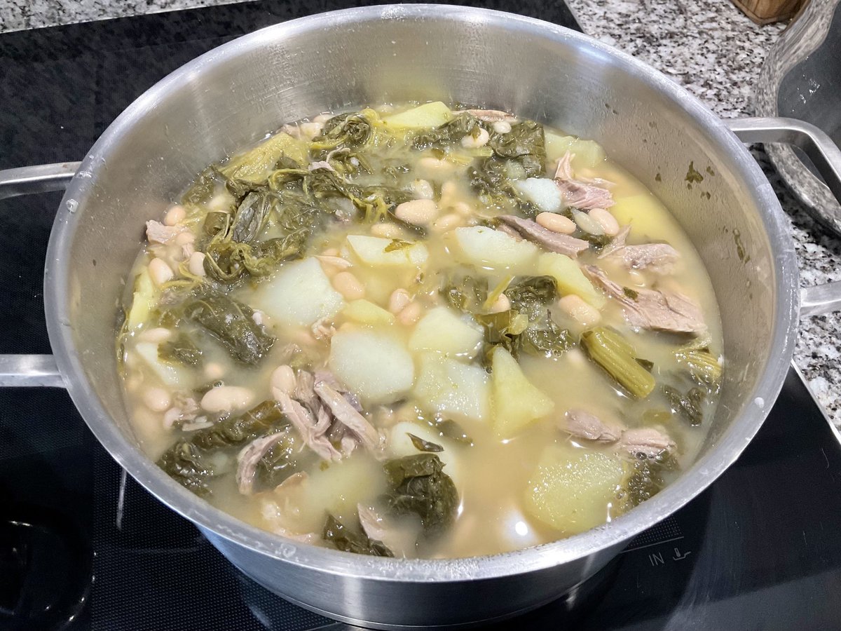 AdrianJMcManus's tweet photo. Orange alert Atlantic storm in #ACoruña calls for some serious comfort food action. Some up leftover salted pork ‘elbow’ chucked in, though no chorizo ‘cos we’re on a diet. #caldogalego #grelos #rapini #turniptops https://t.co/Uum4TitETm