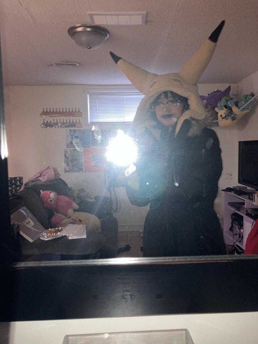 we have this thing called halloweekends at work and i indulge partially bc i love spooky month but mostly bc it's an excuse to wear another layer inside our fucking freezing store

anyway i'm reusing last year's mimikyu and the way it sticks out of my winter jacket is funny