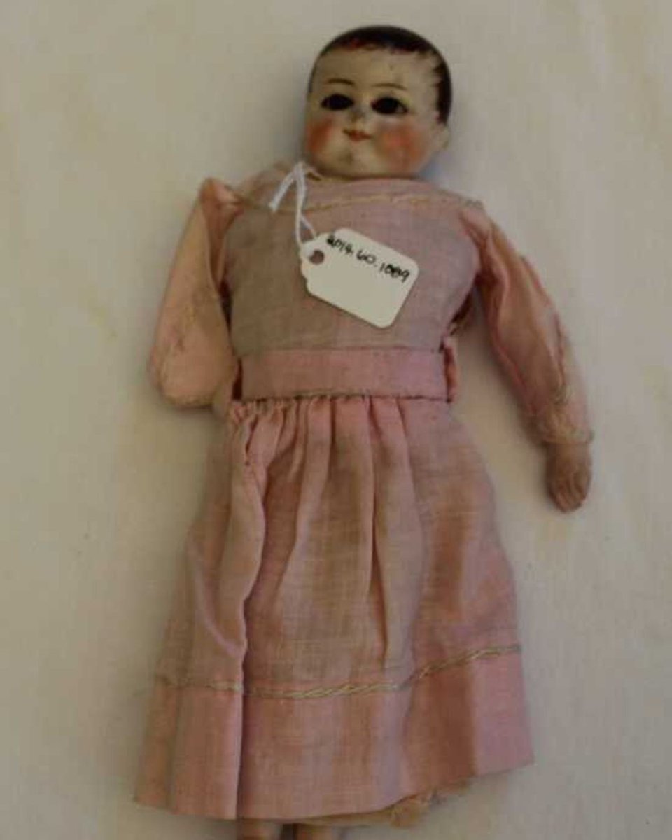 Here's another entry to close out #CreepyDollWeek: here's 2014.60.1089, a doll whose head, arms and feet are made of ceramic and are attached to a body made from coarse netting stuffed with sawdust. It was made between 1900 and 1920, and was owned by  Marie Quinlan of Barre.