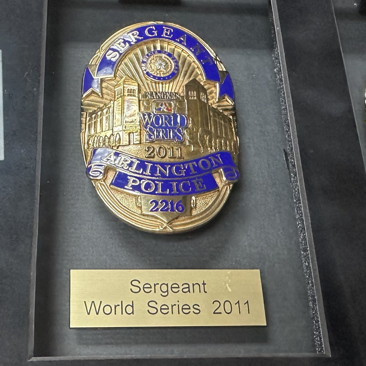 cooktx's tweet photo. Looking at our @ArlingtonPD badges that we commissioned during the 2010 and 2011 World Series and came across this great photo of our motor team that I snapped with the #WorldSeries banner in the background. I noticed Officer Darrin McMichael at the top of the stack… what a great person who left behind a wonderful legacy. We will never forget Officer McMichael. 

I was a sergeant at the time and even though we couldn’t pull it off, we proudly wore these specialty badges for the @Rangers.