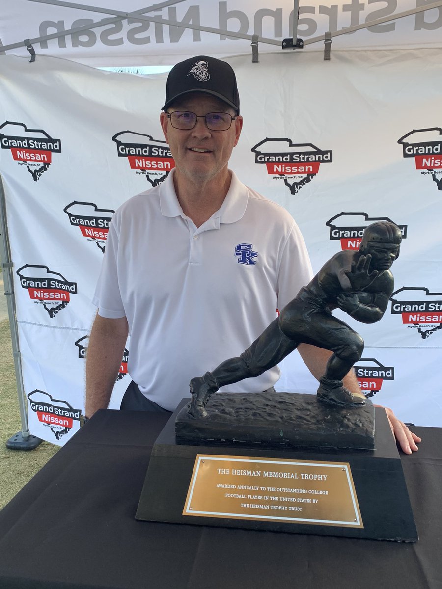 Coach Schraff guarding the Heisman Trophy tonight!