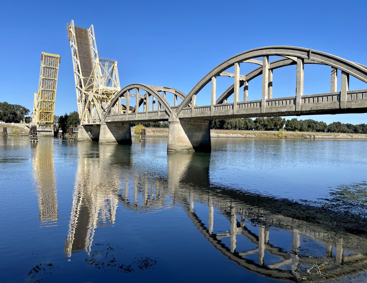 CaltransD4's tweet photo. Isleton Bridge in the Sacramento Delta region celebrated its 100th Birthday on Friday, Oct. 27, 2023, with cake and a commemoration ceremony. https://t.co/ytlplU4aRh
