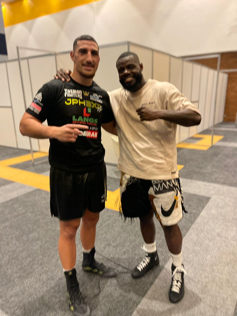 Justis Huni and Andrew Tabiti are all smiles after their 10 round battle that the Aussie won by wide unanimous decision.