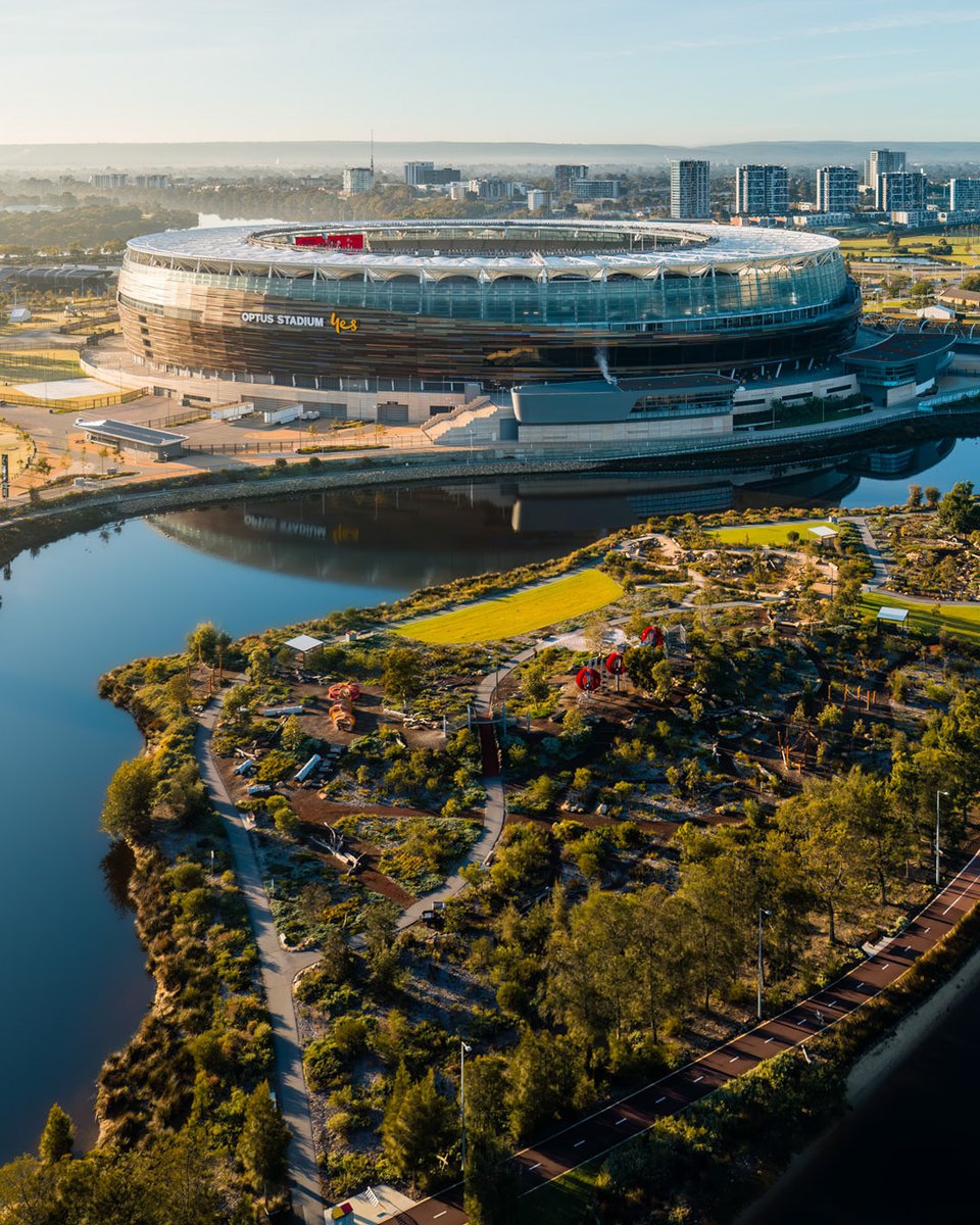 theaguiastudio's tweet image. As the morning sun shines, it lights up @OptusStadium, making it look like a giant mirror on the calm water below. It's like the day is saying 'hello' with a bright smile! 
.
.
#optusstadium #cityofperth #skyperth #wathedreamstate

Optus Stadium photos 👉 bit.ly/3EQqUUJ