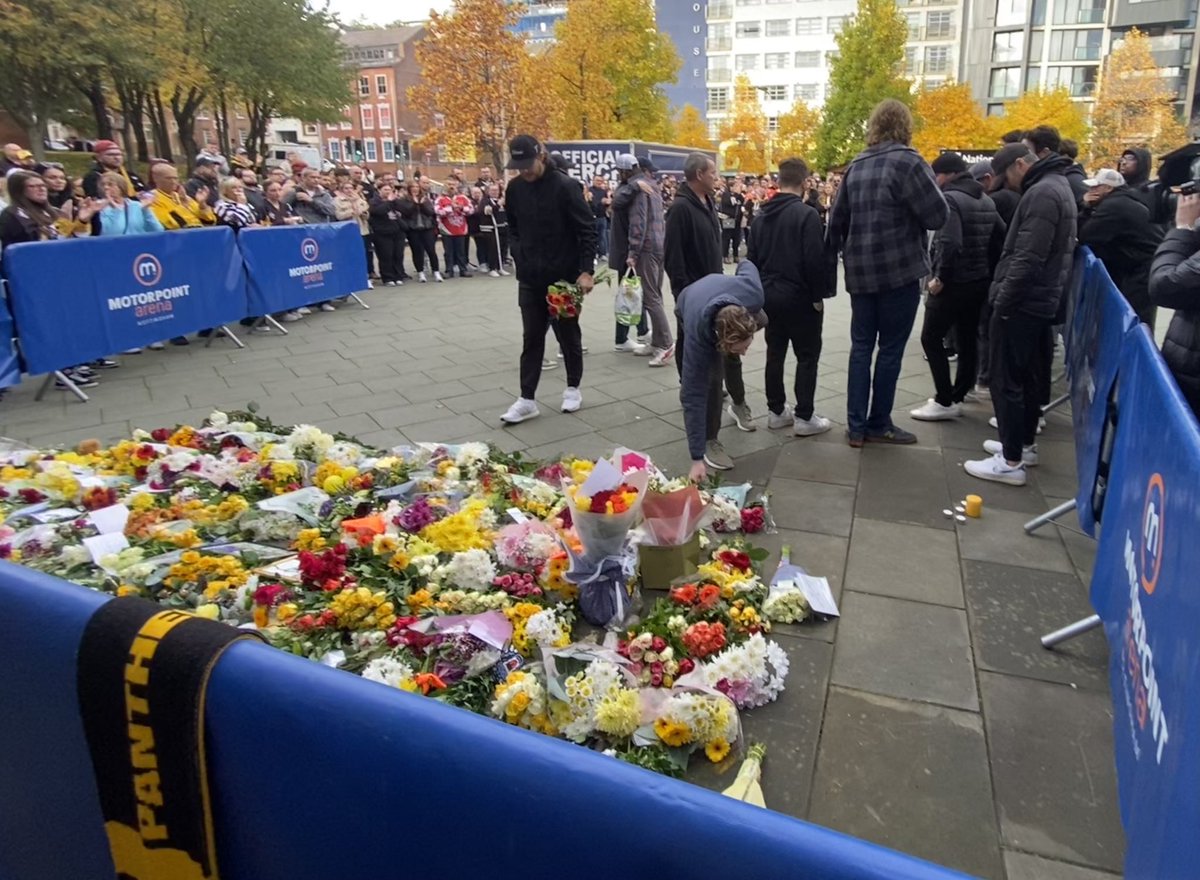 sarahhawleytv's tweet photo. Very emotional scenes as Nottingham Panthers players laid flowers and spoke to hundreds of fans who arrived at the Motorpoint Arena to pay respects to player Adam Johnson who died last night #panthers https://t.co/VnRfVEs6LX