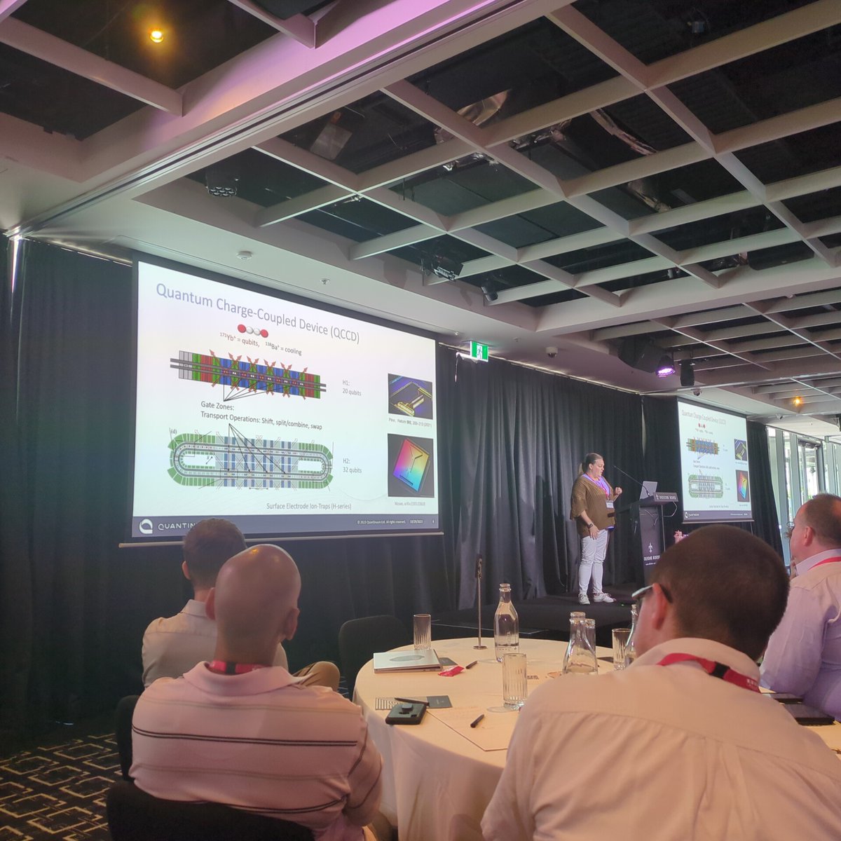 balopat's tweet photo. Natalie Brown showing off @QuantinuumQC QCCD architecture with also mid-circuit measurements used in QEC. It's cool to see ions running around the chip. Steane code paper (Ryan-Anderson etc al 2021) recommended (students especially) for experimental QEC proposal #QEC23 https://t.co/z7GYdAretz