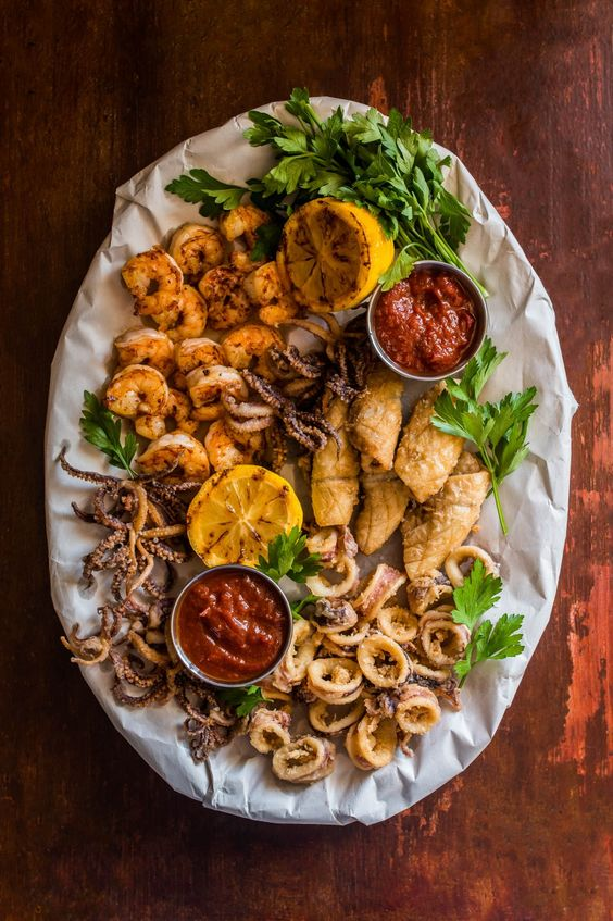 summer_food's tweet image. A crispy squid and shrimp platter is a delectable seafood dish that features lightly battered and fried squid and shrimp, creating a delightful combination of flavors and textures!
