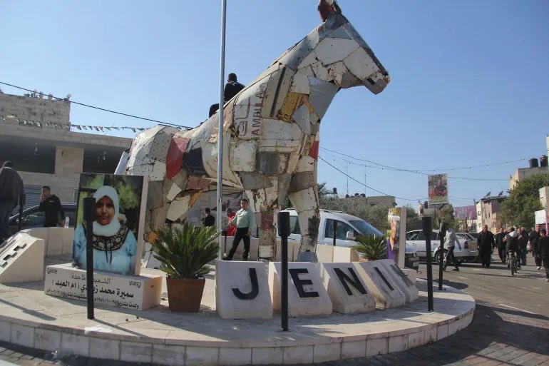 Hanine09's tweet image. The erasure of symbols of resistance is foundational to settler colonialism. 

Today, Jenin’s Horse landmark, was stolen by Israeli bulldozers. The Horse, constructed from the remnants of an ambulance bombed by the Israeli occupation in 2002, represented strength and courage.