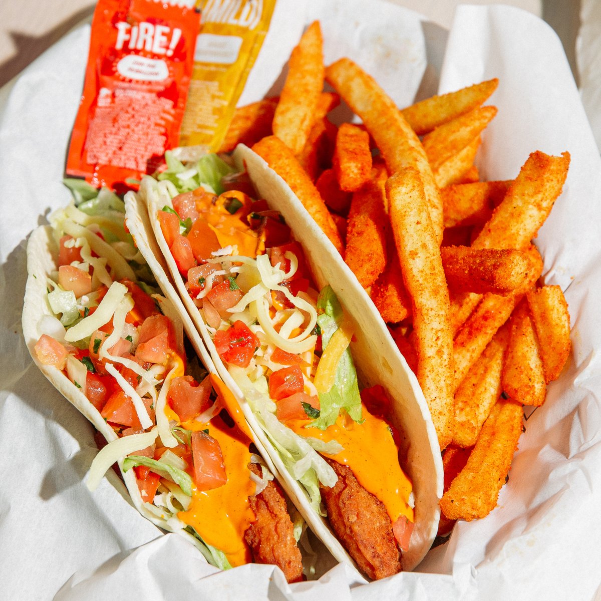 soft flour tortilla with a crispy chicken tender, topped with fresh lettuce, tomatoes, shredded cheese and a squeeze of our famous Lava sauce. Yeah, the Lava Crispy Chicken Taco is that good.