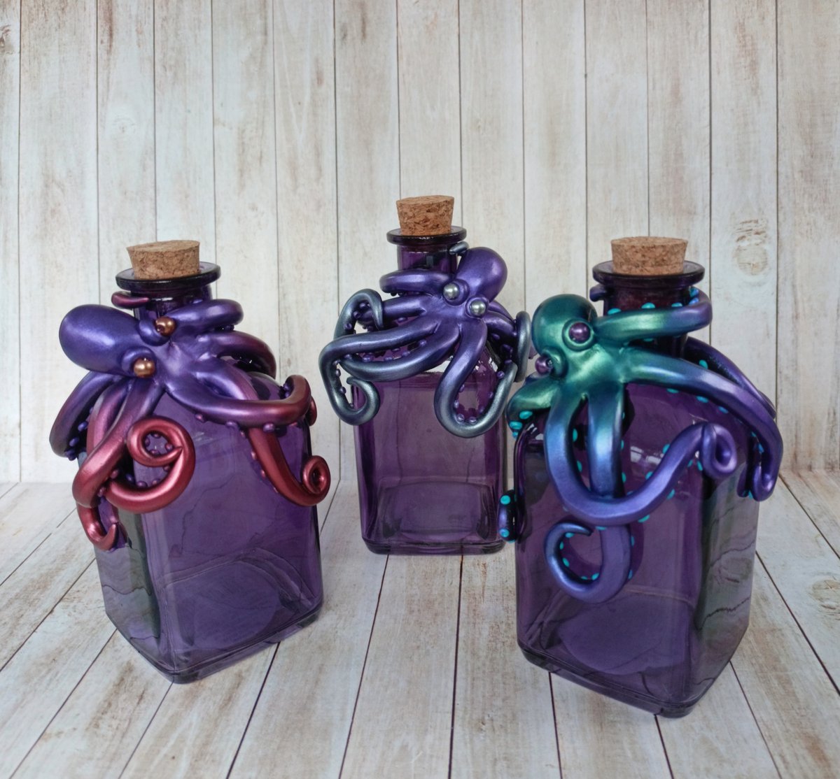Purple glass bottles with an octopus sculpture are now available in my Etsy shop! There's a choice of colours for your octopus :) #octopus #giftideas #etsy etsy.me/3MmMeWp via @Etsy