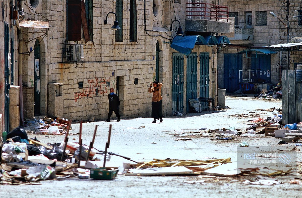 RealWorldImage's tweet photo. Two kids venture out during curfew during tensions in Beit Jala, West Bank, Palestine in 2002. Gary Moore photo. Real World Photographs. #war #conflict #Nikon #realworldphotographs #garymoorephotography #Palestine #conflict #BeitJala #photography #photojournalism https://t.co/adSxt5BROI