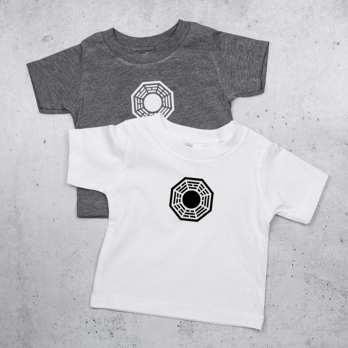 dharmasupply's tweet photo. We also have a small batch of baby clothes printed right here on the island using HTV. The onesies have a smooth matte design and the grey and white tees use flocked vinyl so the logo is slightly raised and fuzzy! https://t.co/uSyjLGbbD6
