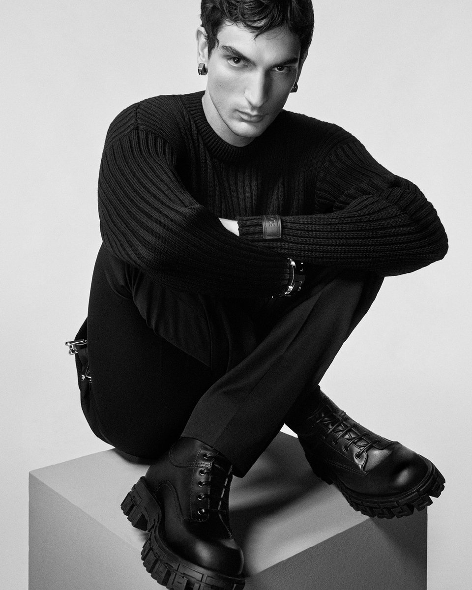 Versace's tweet photo. Greca Portico Boots for #VersaceFW23

Luca wears ribbed-knit sweater; pants; Greca Portico boots

Photography by Ilya Lipkin

#Versace https://t.co/FARG70ClgK