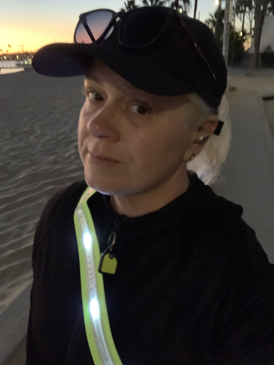 Up and running before sunrise.  Wearing a neon green sash with reflective strips and flashing bright LED lights. 

Still almost got hit by a car.