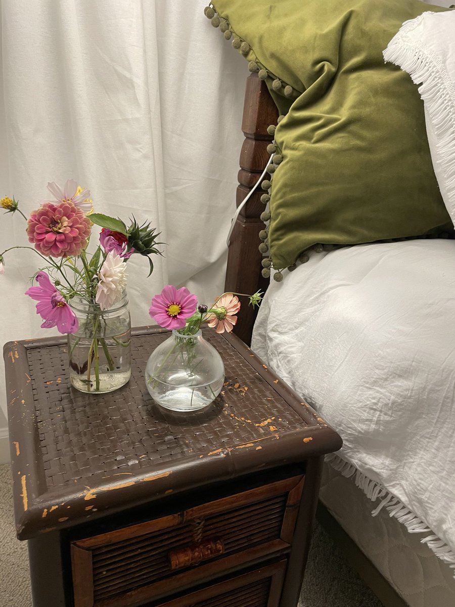 Staying with a friend who put flowers on my nightstand. ❤️