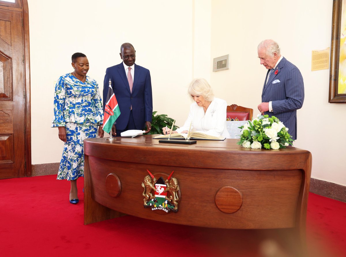 PICTURE: Queen Camilla signs guest book at State House, Nairobi.

The Queen is wearing white crepe silk dress by Anna Valentine, with diamond oyster brooch, which belonged to late Queen Elizabeth. #TheRoyalVisit