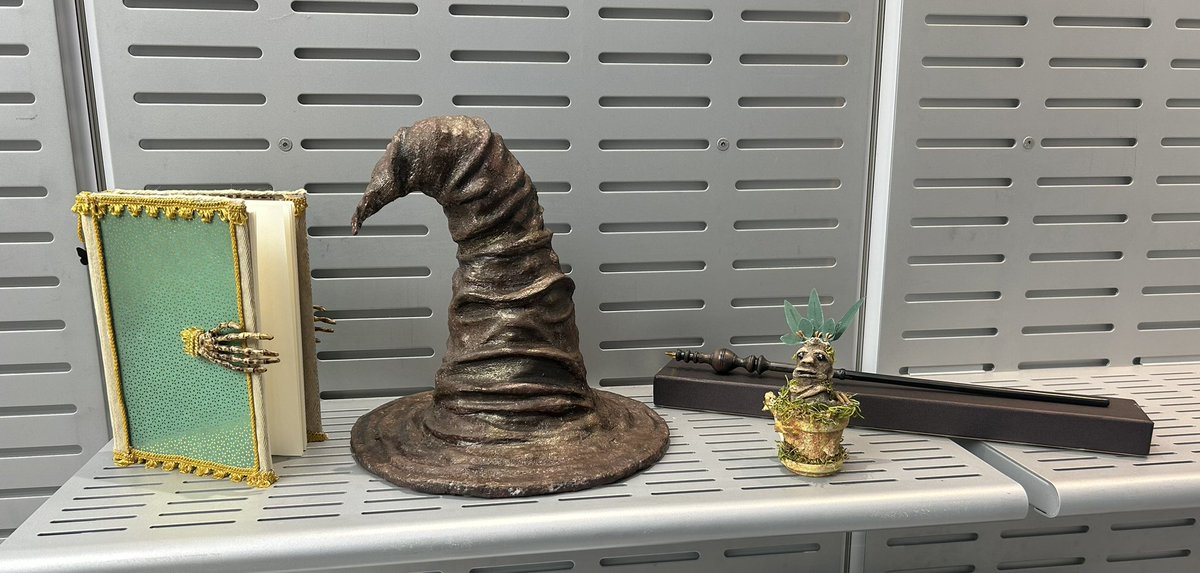 LynnSeats's tweet photo. Got to dress up for Halloween at work, decided to be Minerva McGonagall. Also brought along the Harry Potter crafts I made, including the sorting hat/spell book/mandrake #HarryPotter #Hogwarts https://t.co/YZMa8g0mdg