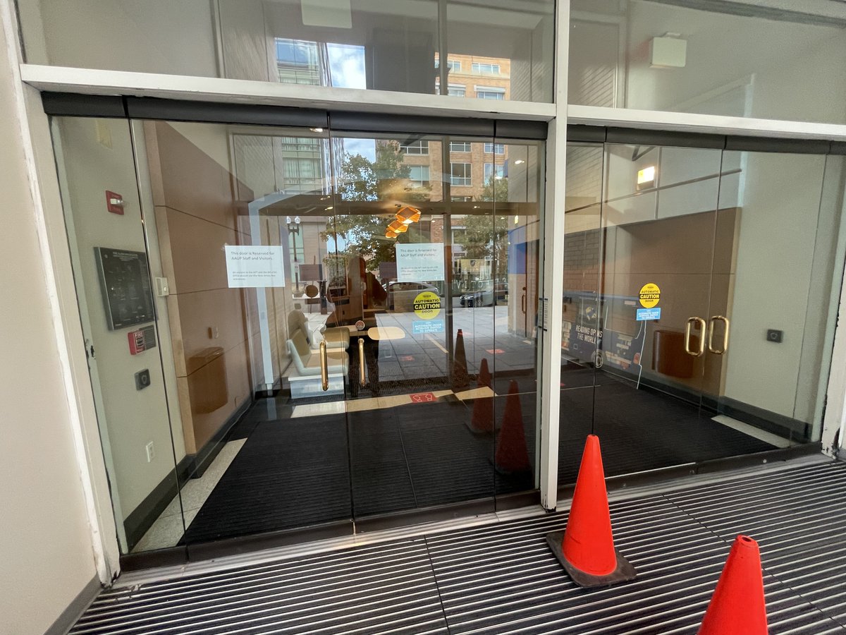 us_aaup's tweet photo. Here is a sign posted at the AFT building, which houses the @aaup's DC office, establishing this as the sole entrance for AAUP staff, making every other entrance to the building a "neutral gate." A neutral gate is a picket-busting tactic, as we assume @imulvey knows. https://t.co/nI1dp1ZtJi