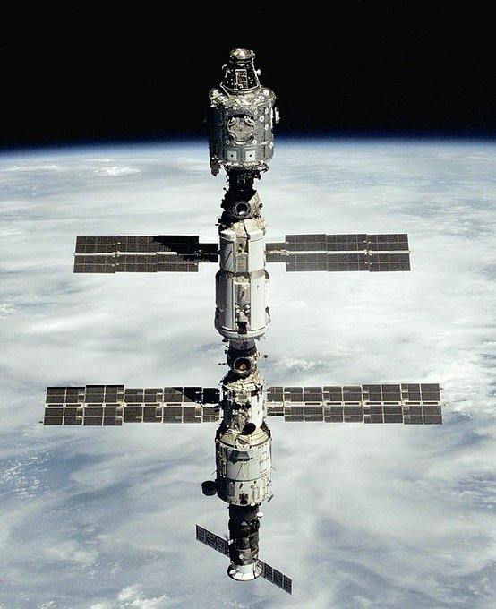 The International Space Station as seen from the departing Space Shuttle Atlantis on STS-106 following the arrival of the Russian Zvezda Service Module to the orbital complex. In view from top to bottom are the Unity Module, the Zarya FGB, the Zvezda SM and the docked Progress M1-3 spacecraft. During the course of the mission, the STS-106 crew readied the station for permanent occupation by outfitting it in preparation for the arrival of its first residents, the three-man Expedition 1 crew, launched aboard Soyuz TM-31 on 31 October 2000.