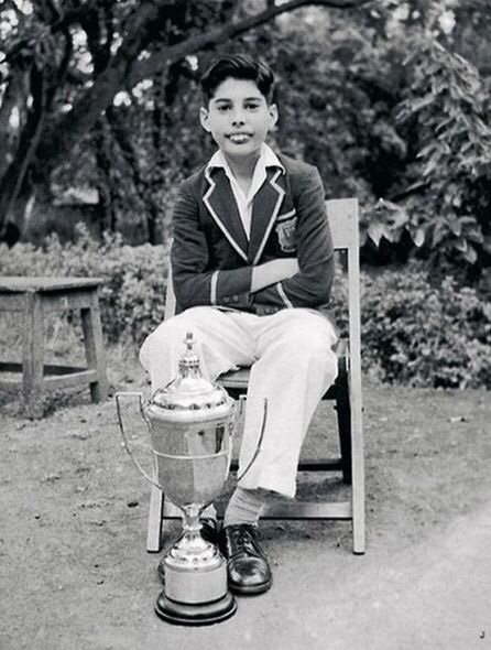 A young Freddie Mercury with the trophy he won, 1958