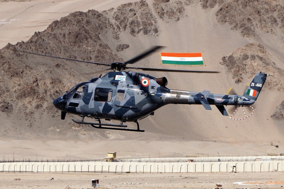 Newly hoisted flag and new helicopter.