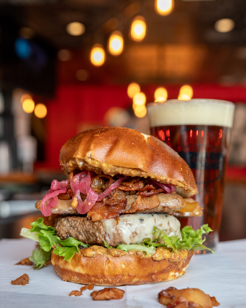 New month, new burger! All October, get the Blitzkrieg Burger! This 8 oz. Certified Angus beef patty is topped with Swiss cheese,  bratwurst, german slaw, pickled onions, and stone ground mustard. Tag a MEATY LOVAH!