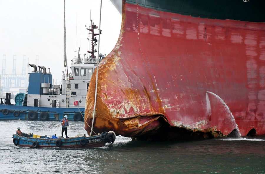 XHNews's tweet photo. Giant cargo ship Ever Given that blocked the Suez Canal for nearly one week in March reaches east China's coastal city of Qingdao for repairs https://t.co/DwSgSiWaeX https://t.co/QySl9A6gmi
