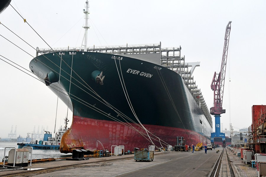 XHNews's tweet photo. Giant cargo ship Ever Given that blocked the Suez Canal for nearly one week in March reaches east China's coastal city of Qingdao for repairs https://t.co/DwSgSiWaeX https://t.co/QySl9A6gmi