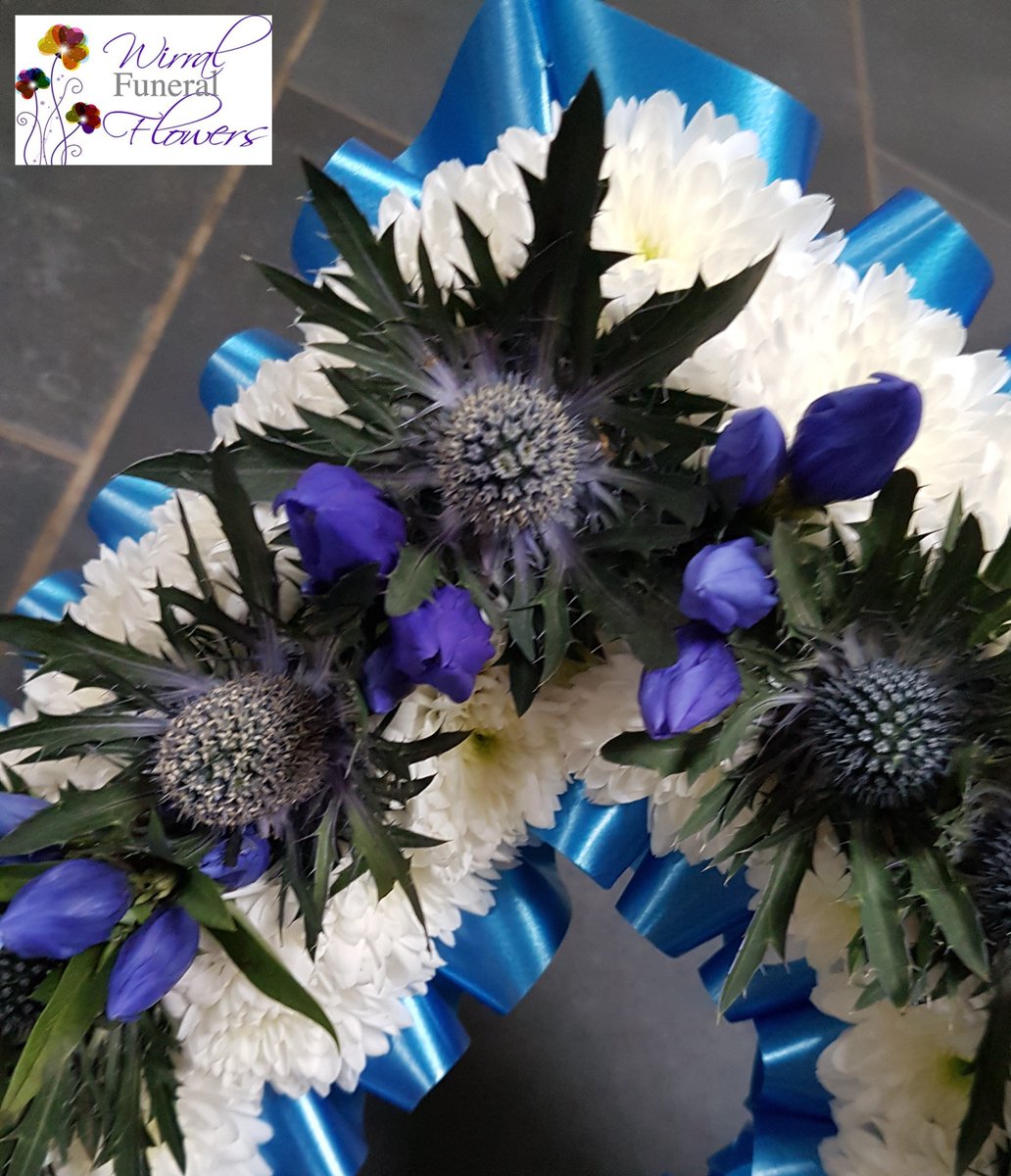 DAD Funeral Flowers in blue & white for an Everton fan. Blue ribbon edge, white outline, with blue thistle & gentian down the centre #wirralfuneralflowers #Everton #prentonflorist #EFC #dadfuneralflowers #dadtribute #wirral #funeralflowers